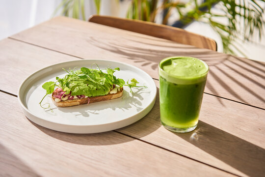 healthy avocado toast and green smoothie