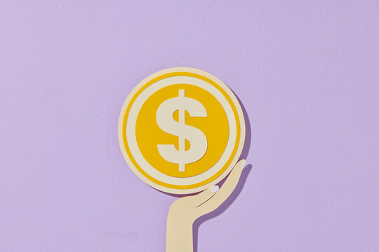 hand holding money coins on background concept of money
