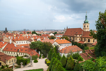 Fototapeta na wymiar Aerial panoramic view of Prague against a cloudy sky.