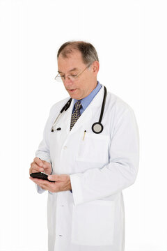 A caucasian doctor with a receding hairline wearing a white lab coat. He is shown on a white background with a pda.