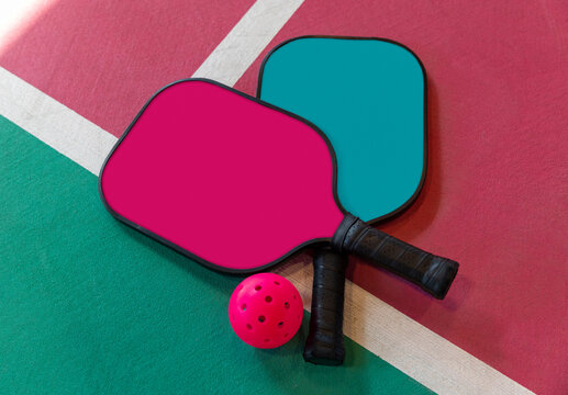 Pickleball paddle Racquets on court 