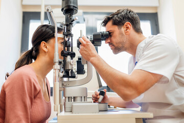 Doctor checks the eyesight of a patient