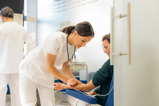 Young woman doctor and female oncology patient