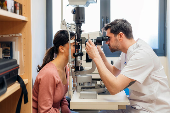 Doctor checks the eyesight of a patient