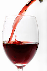 Red vine pouring in a glass