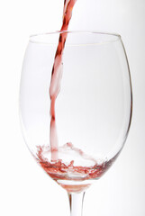 Red vine pouring in a glass