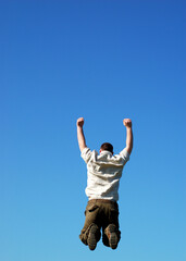 happy man jumping on sky background