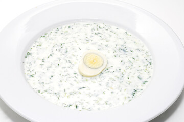 Cold kvass (cold kefir) soup with chopped vegetables and meat.