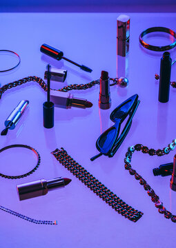 female accessories on glass surface