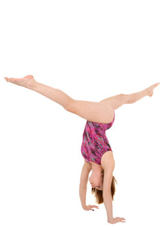 Caucasian teenage girl in gymnastic poses on white background