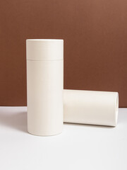 Two white cardboard tubes. Durable cardboard packaging