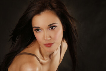 Portrait of the beautiful brunette in studio