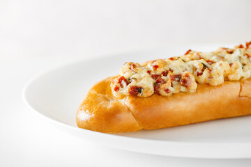 Pizza baguette, on white plate background, side view, selective focus