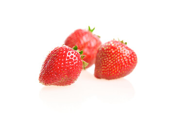 Strawberries over white background