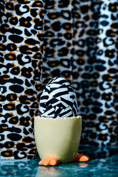 easter egg in a chick-shaped eggcup