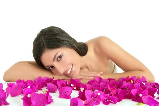 Beautiful indian woman portrait with bougainvilleas flowers over white