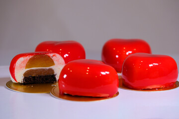 Steadicam front footage of modern, european pink glazed dessert in cutaway. Cutaway Mousse Cake Red...