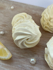 Lemon marshmallows on the wood background