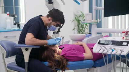 Dentistry clinic detailed checkup of female patient on couch focused dentist in medical mask and rubber gloves checking teeth condition of woman with dental tools