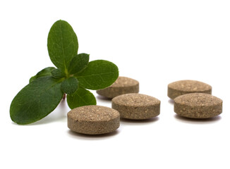 Fototapeta premium herbal pills isolated on white background
