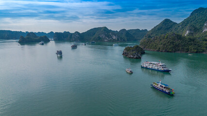 Fototapeta na wymiar Aerial view of Ha Long bay, Vietnam on a cloudy and dark day. UNESCO World Heritage site, popular landmark, the most famous destination of Vietnam