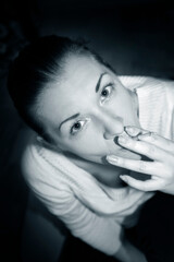 Portrait of the beautiful woman with a cigarette in studio