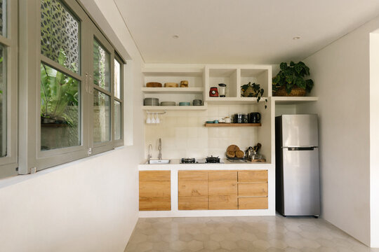 Wide angle interior image of bright tropical kitchen