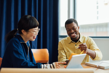 Man and Woman Working Together in Office