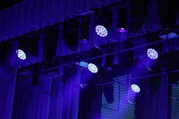 Blue spotlights on top stage lighting. - obrazy, fototapety, plakaty