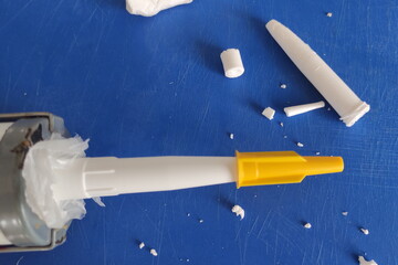 Dried silicone sealant in the tube tip