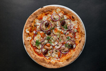 Pizza top view on dark background