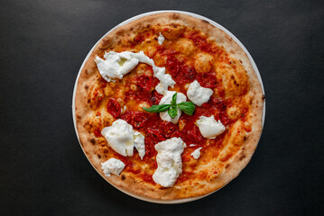 Pizza top view on dark background