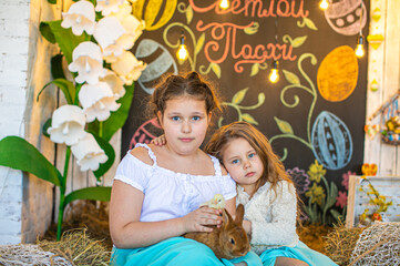 Beautiful girl in white dress standing on bed