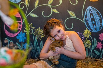 Beautiful girl in white dress standing on bed