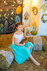 Beautiful girl in white dress standing on bed