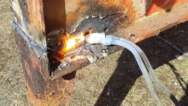 Gas torch with flame closeup - gas cutting of metal construction