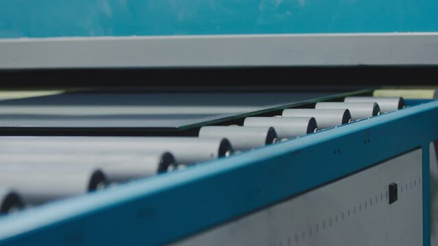 The glass goes into the machine on rollers and goes through the tempering process