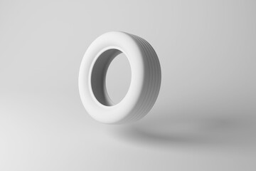 White tyre (US: tire) on white background showing monochrome design. Illustration of the concept of minimalism and transportation