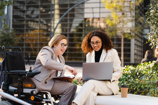 Laughing Female Entrepreneurs On Business Meeting
