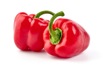 Red ripe bell peppers, isolated on white background.