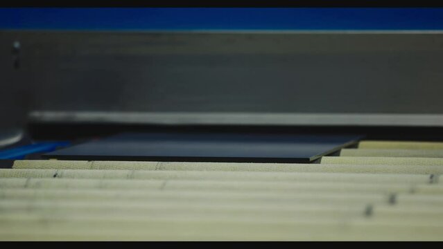 The glass goes into the machine on rollers and goes through the tempering process