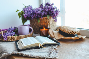 Open bible in spring interior, good morning concept