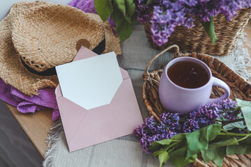 Envelope with letter and gift box in spring decor