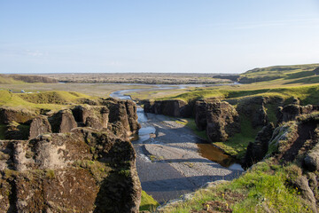 Fototapeta na wymiar View of the cliffs and a river from above a Canyon Iceland