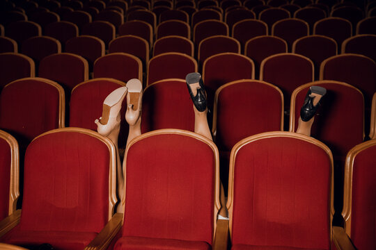 Women's feet in the theater