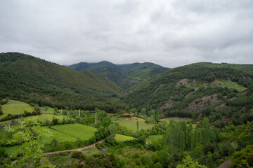 Landscape of mountains in green valley.