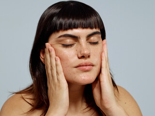 Woman using skincare lotion