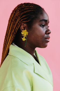 Studio portrait of gorgeous woman with braids hairstyle