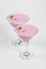 Pink tea matcha cream pudding, Pitahaya Panna Cotta in martini glass. White background