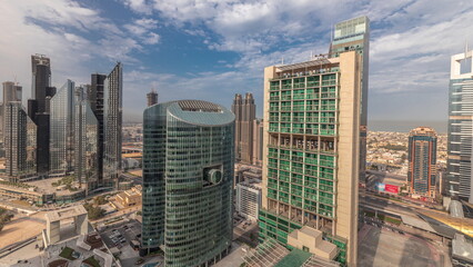 Panorama showing Dubai international financial center skyscrapers with promenade on a gate avenue aerial timelapse.